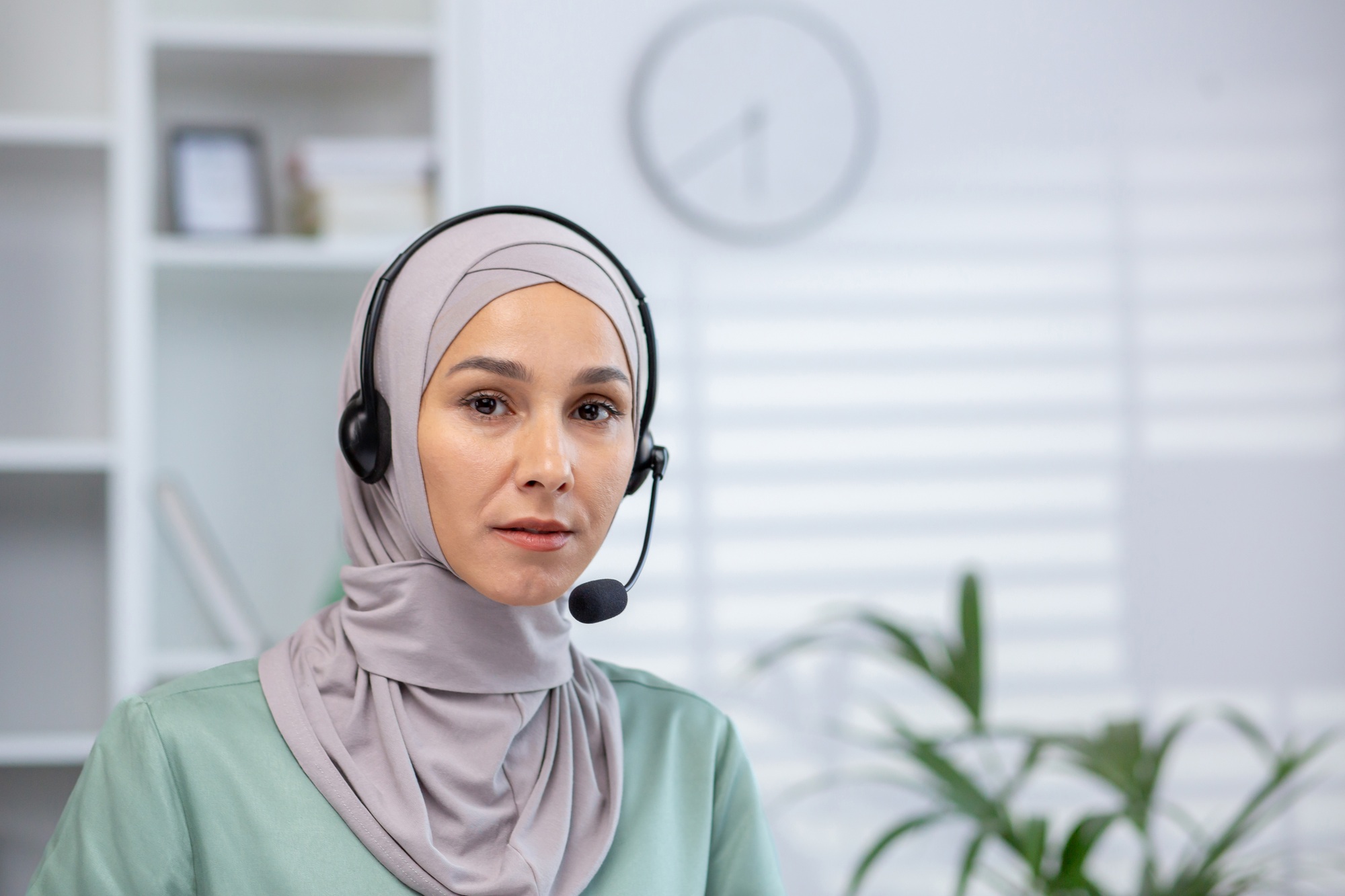 Confident woman in hijab working as customer support representative